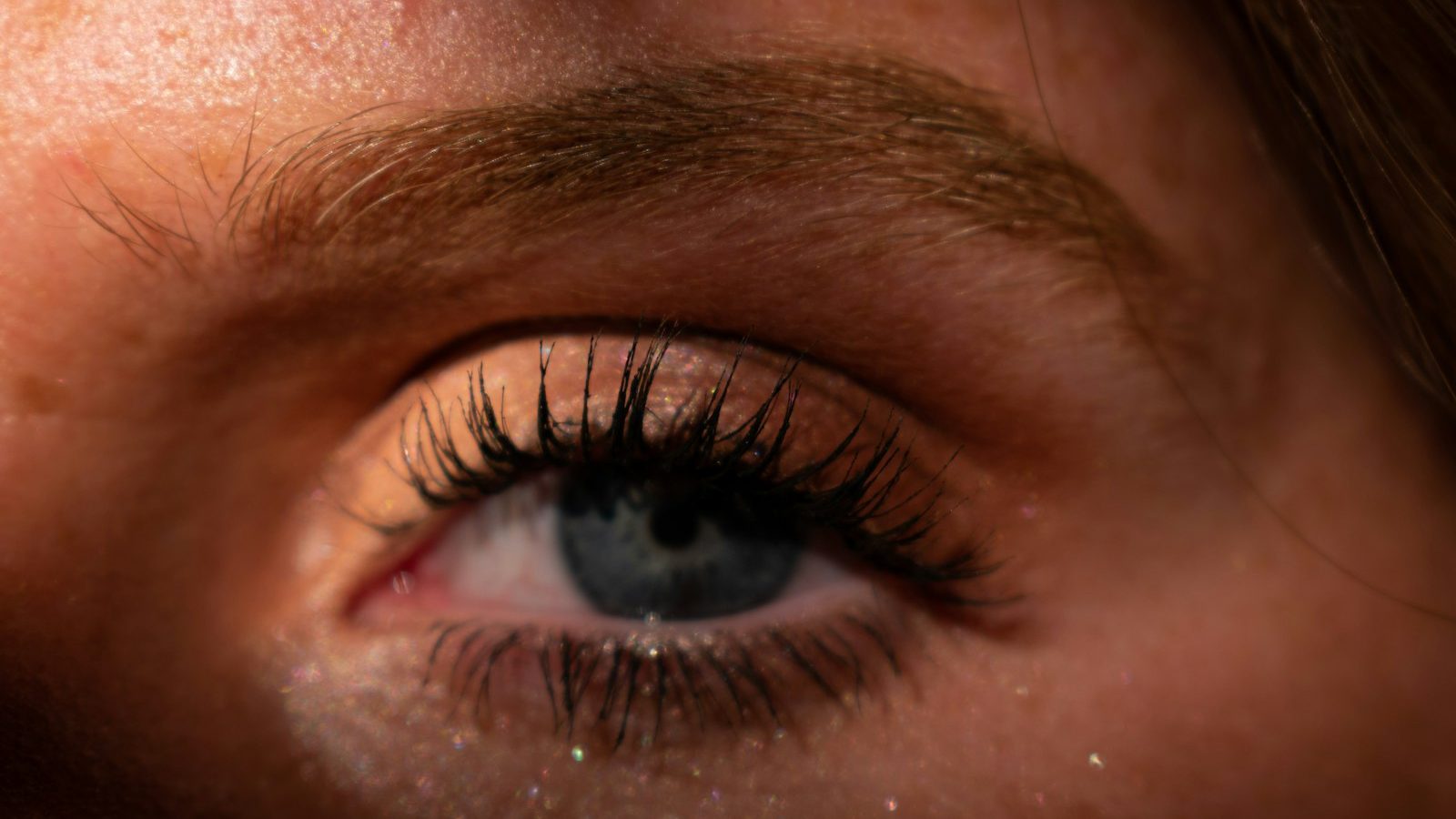 Eyelash extensions: eye with long lash extensions