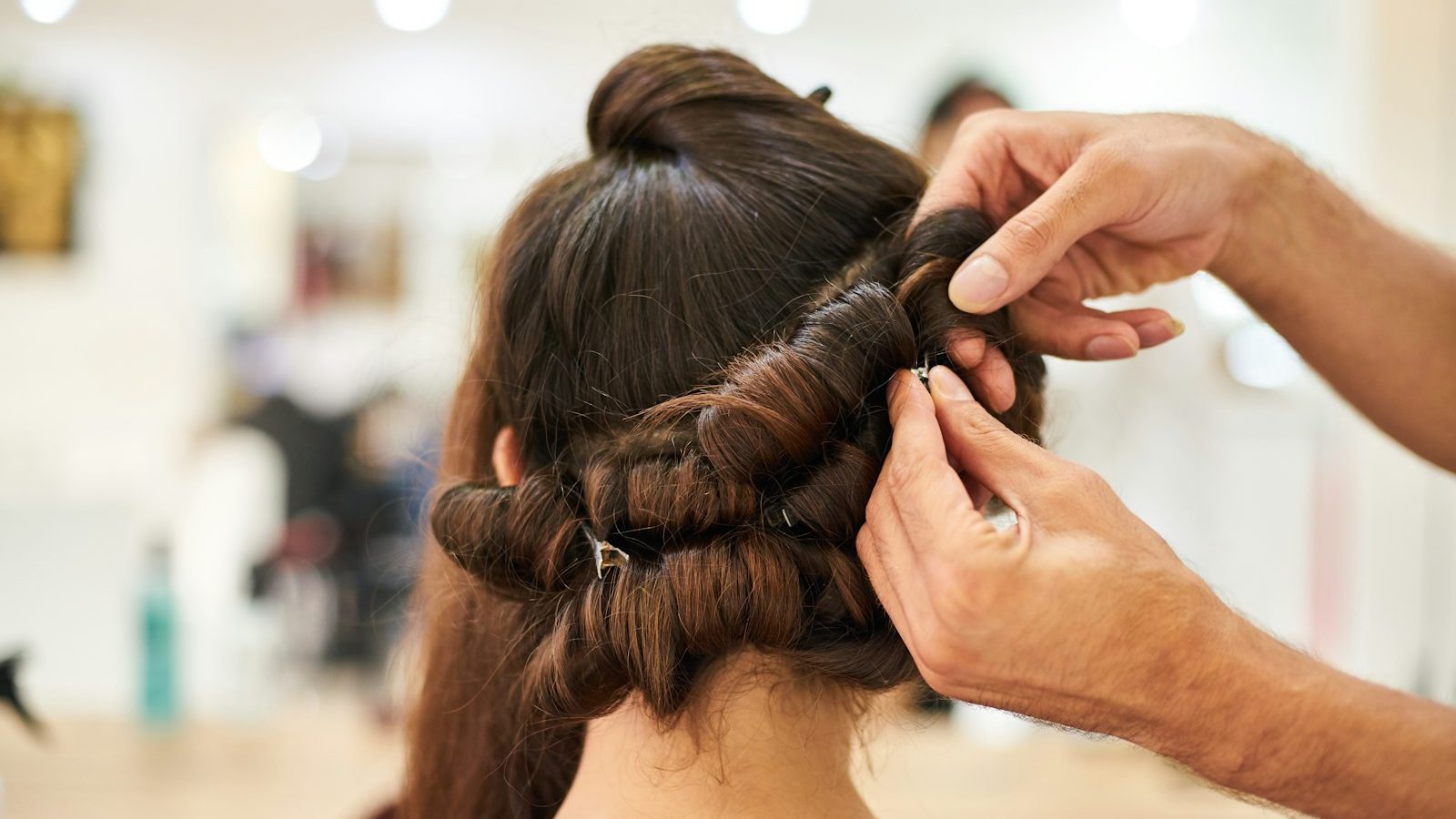 Top rated ladies salon: hairdresser setting hair in rolls