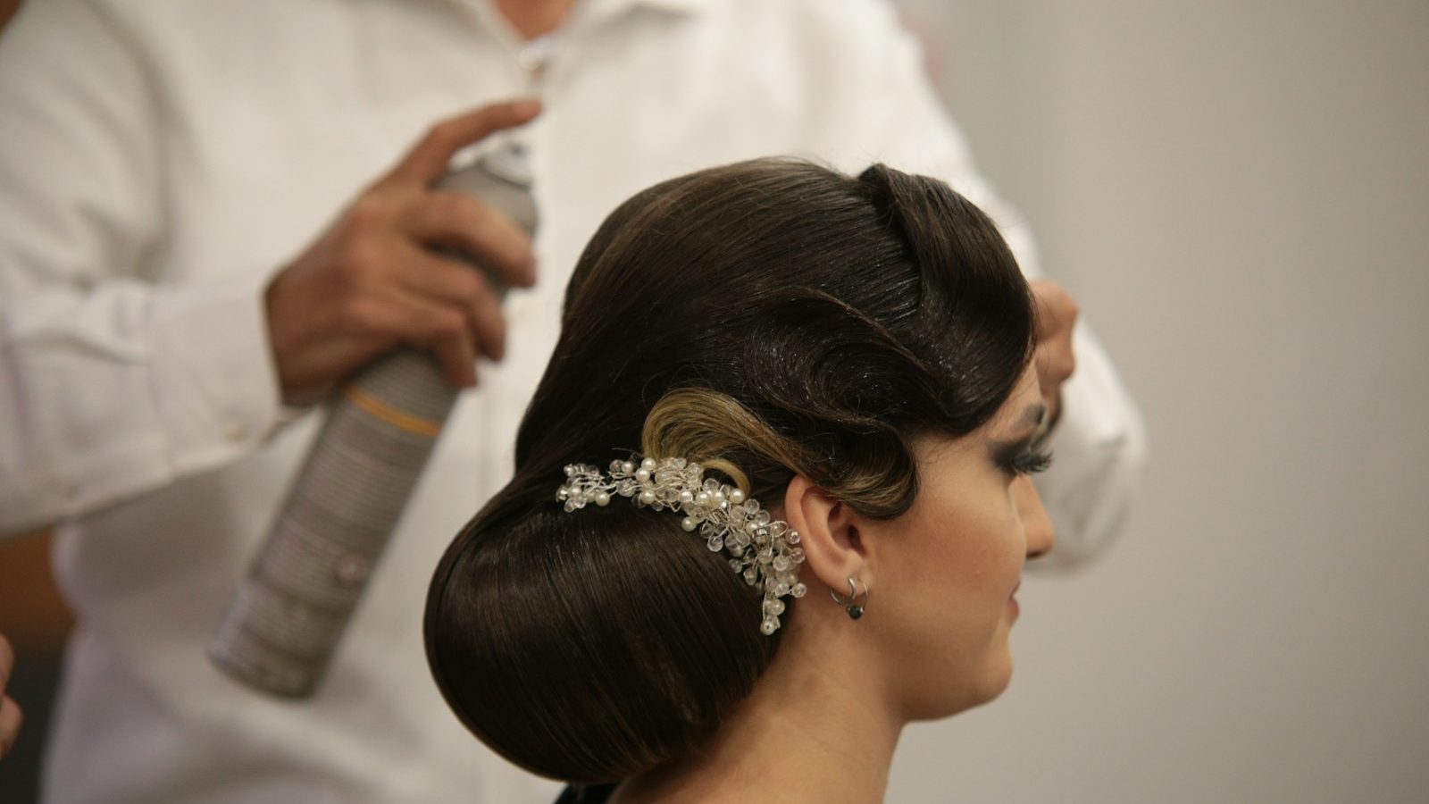 Top rated salon: finishing spray on an elegant bridal updo