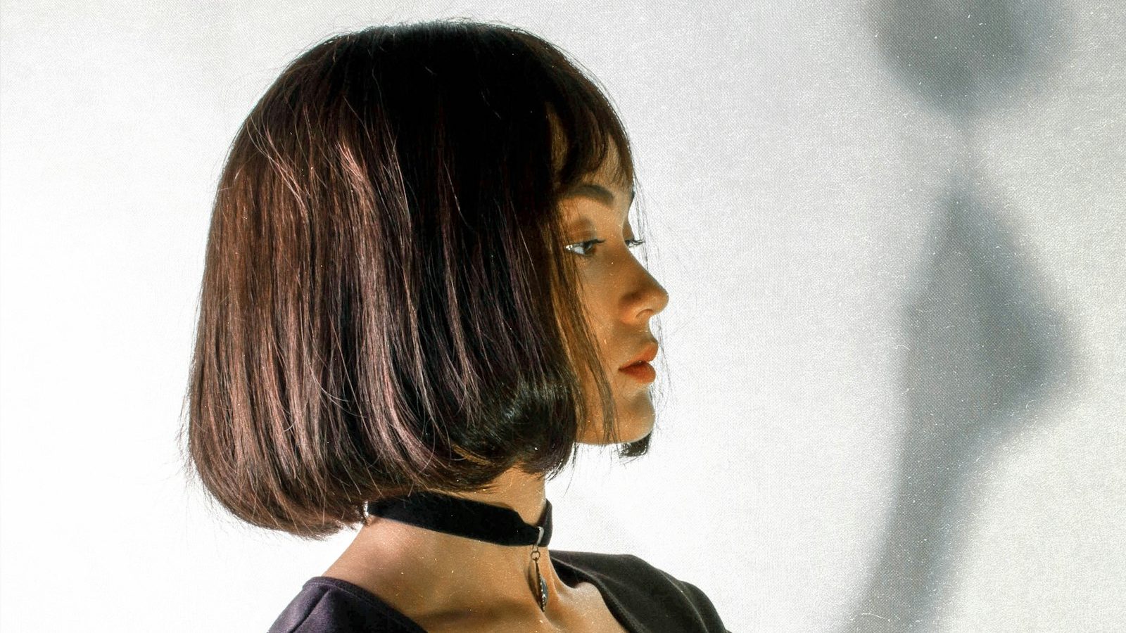 Hair cut salon near me within 400m: woman with a sleek brown bob haircut