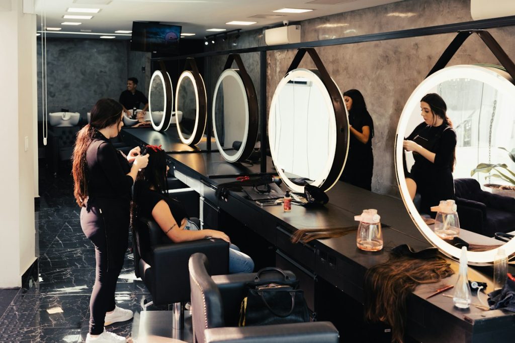 Previously colored hair: stylists working with clients in front of round mirrors